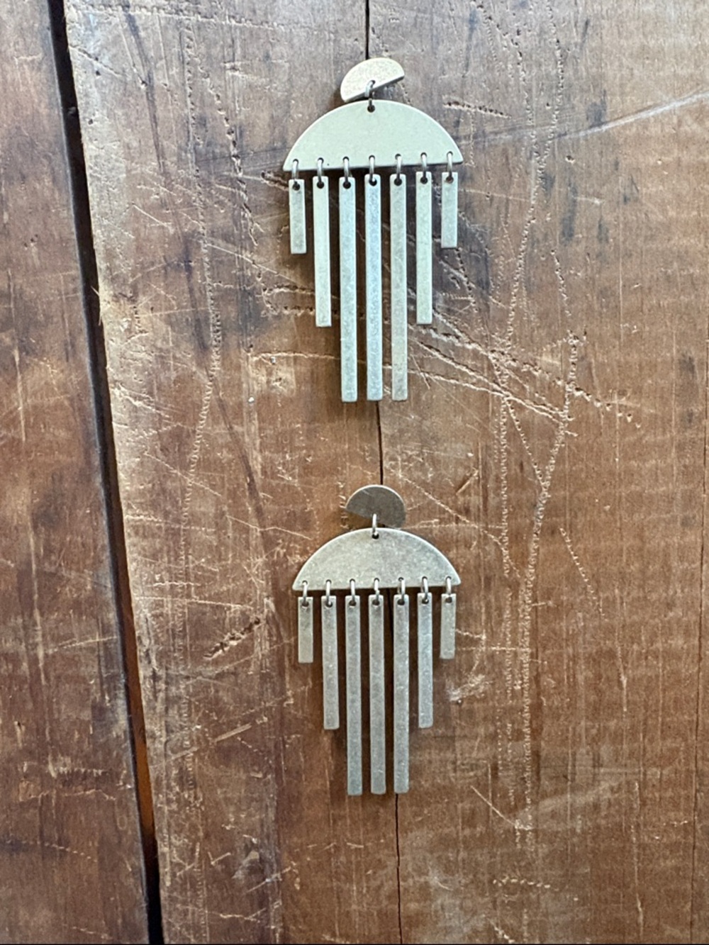 Gold dangly earrings , fringe